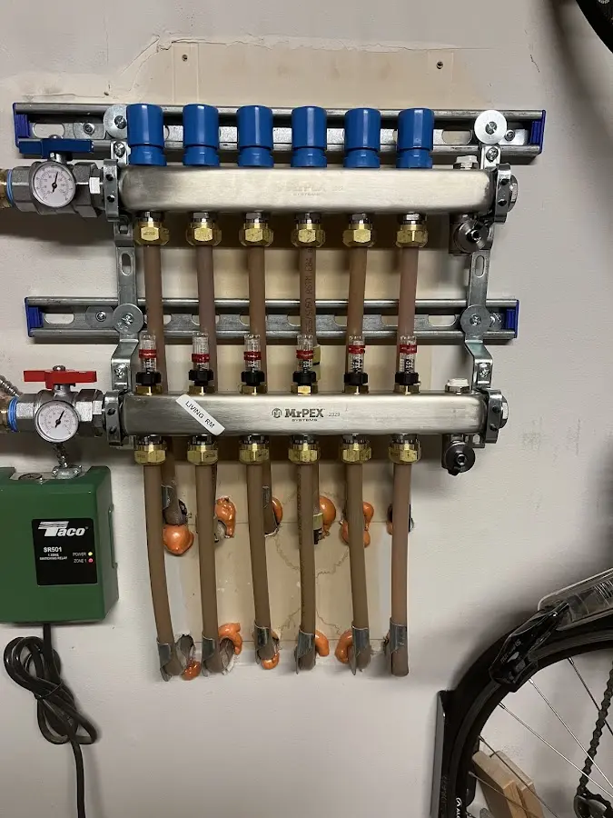 Plumber performing Water Heater Repair at a residential property in Holton